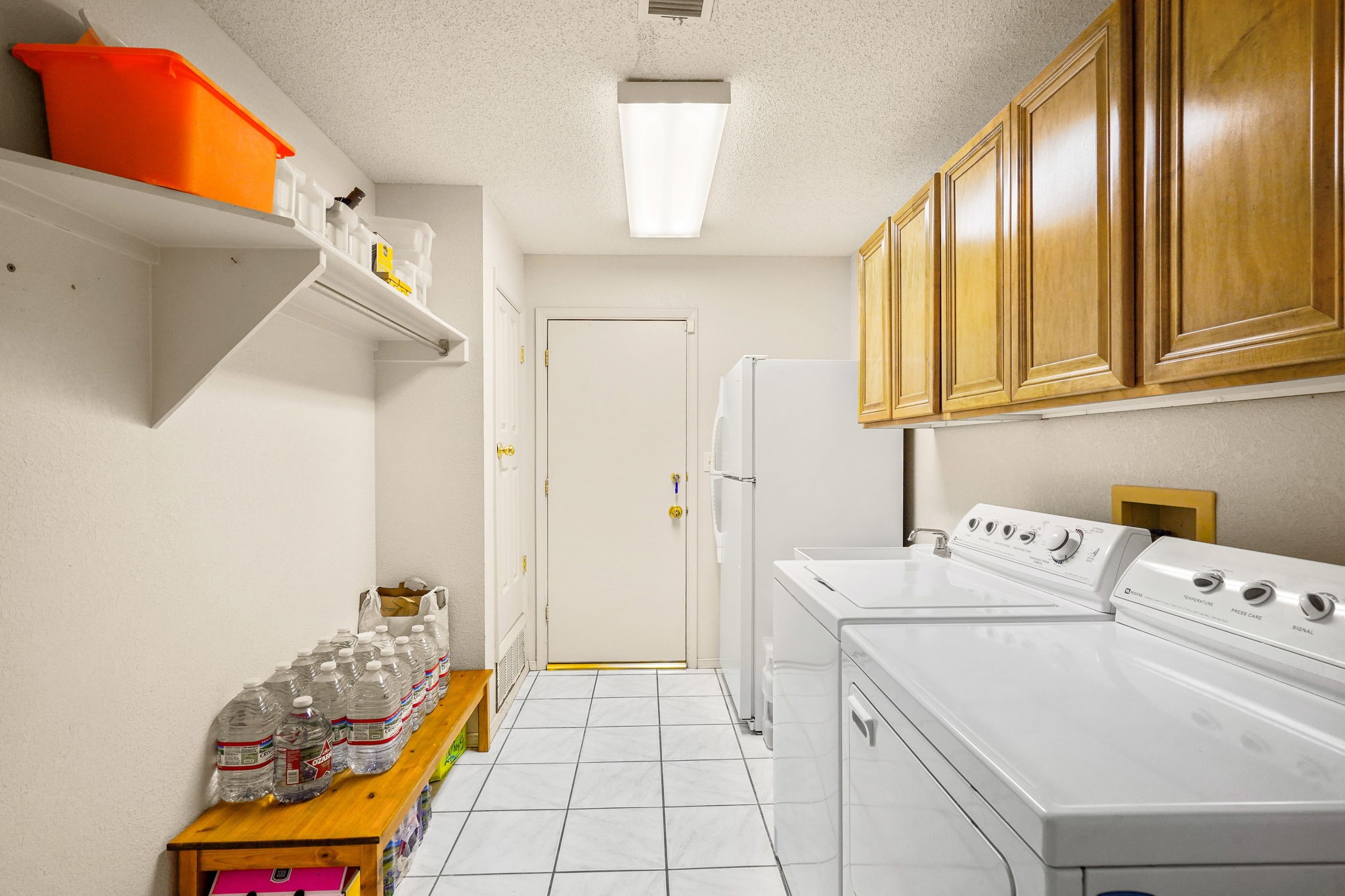 6574 Eagle Ridge Drive El Paso, TX 79912 - Photo 30 of 50 a utility room with dryer and washer