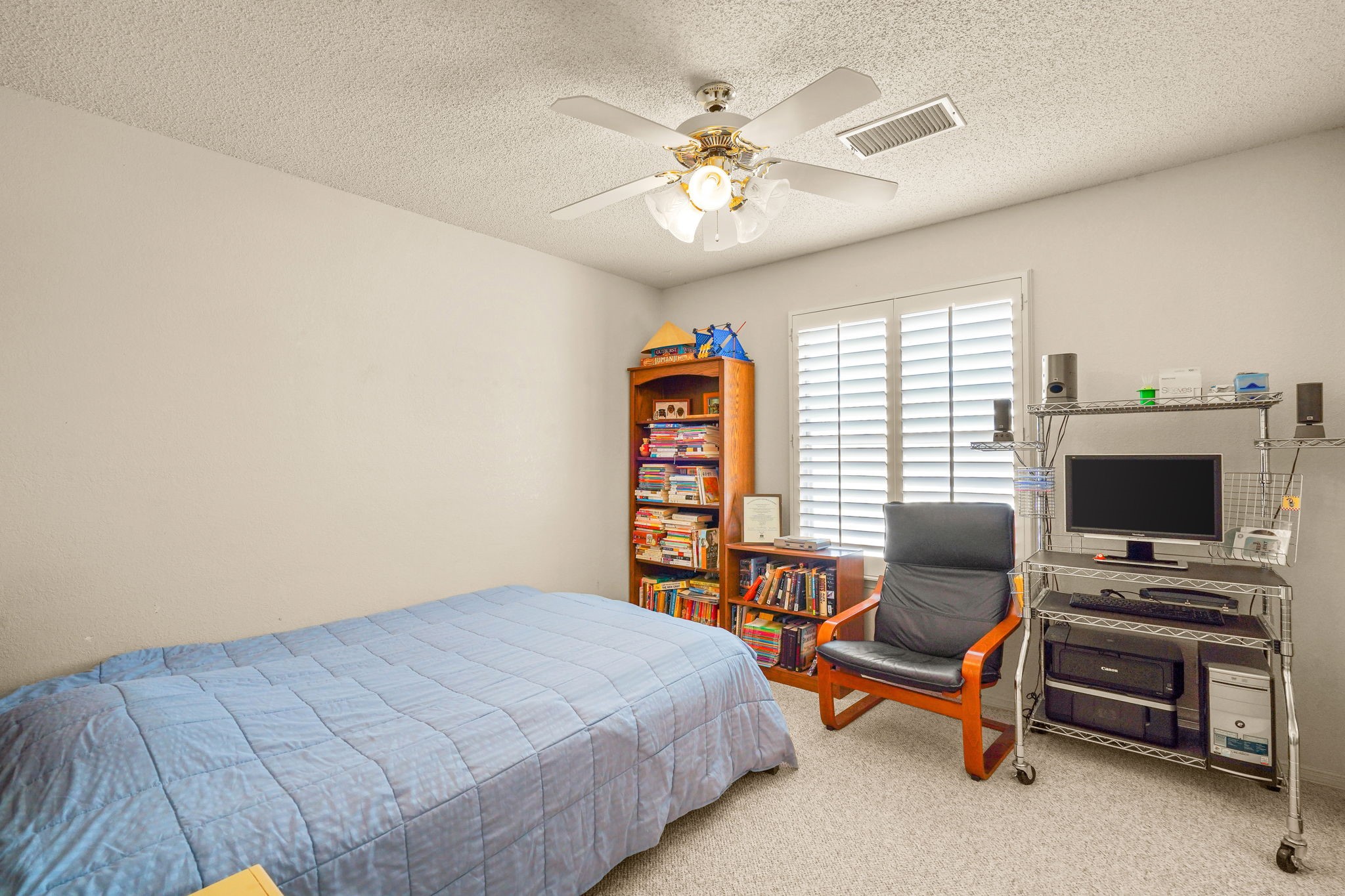 6574 Eagle Ridge Drive El Paso, TX 79912 - Photo 36 of 50 a bedroom with a bed and a chandelier
