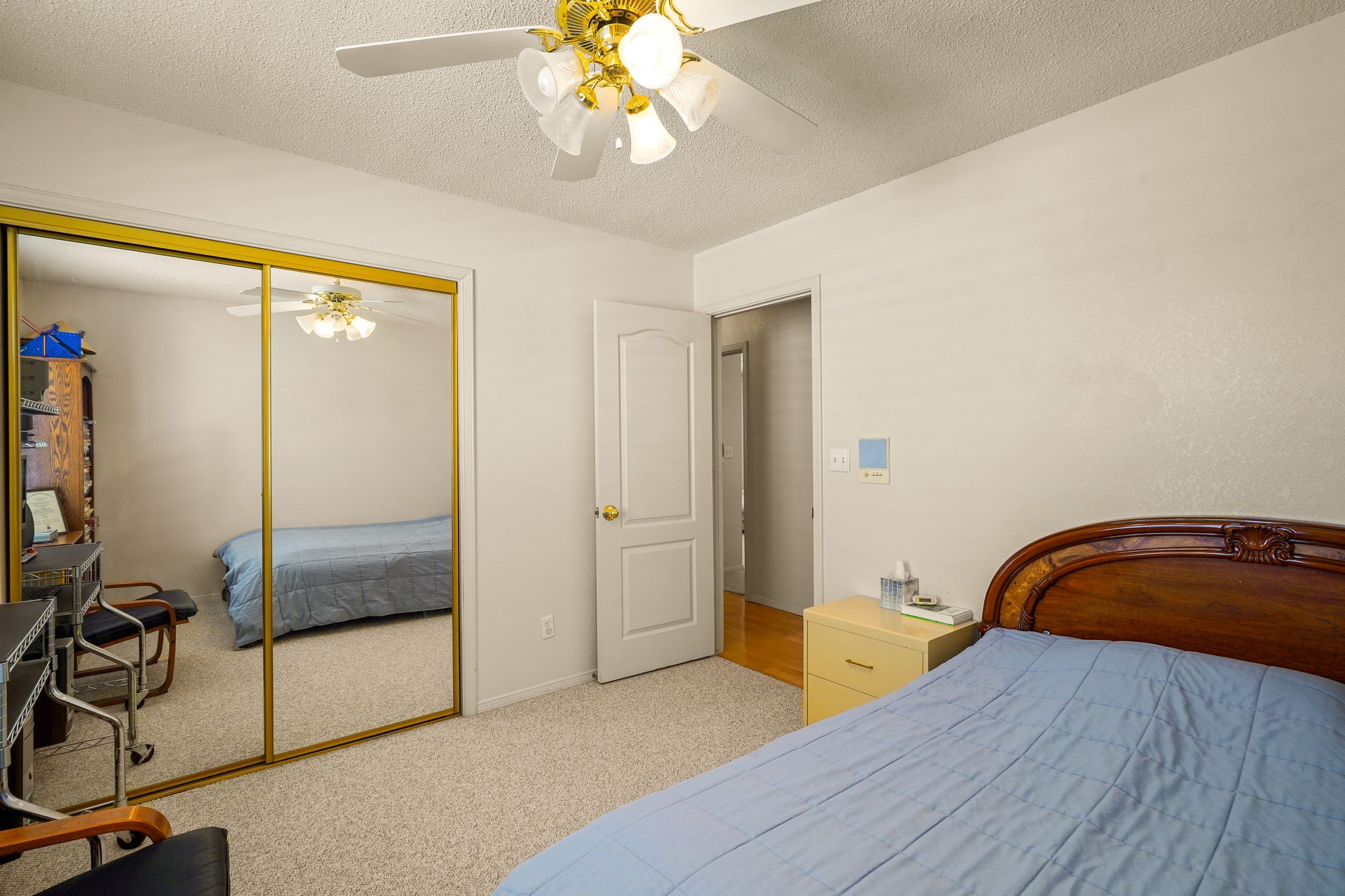 6574 Eagle Ridge Drive El Paso, TX 79912 - Photo 37 of 50 a bedroom with a bed and a chandelier