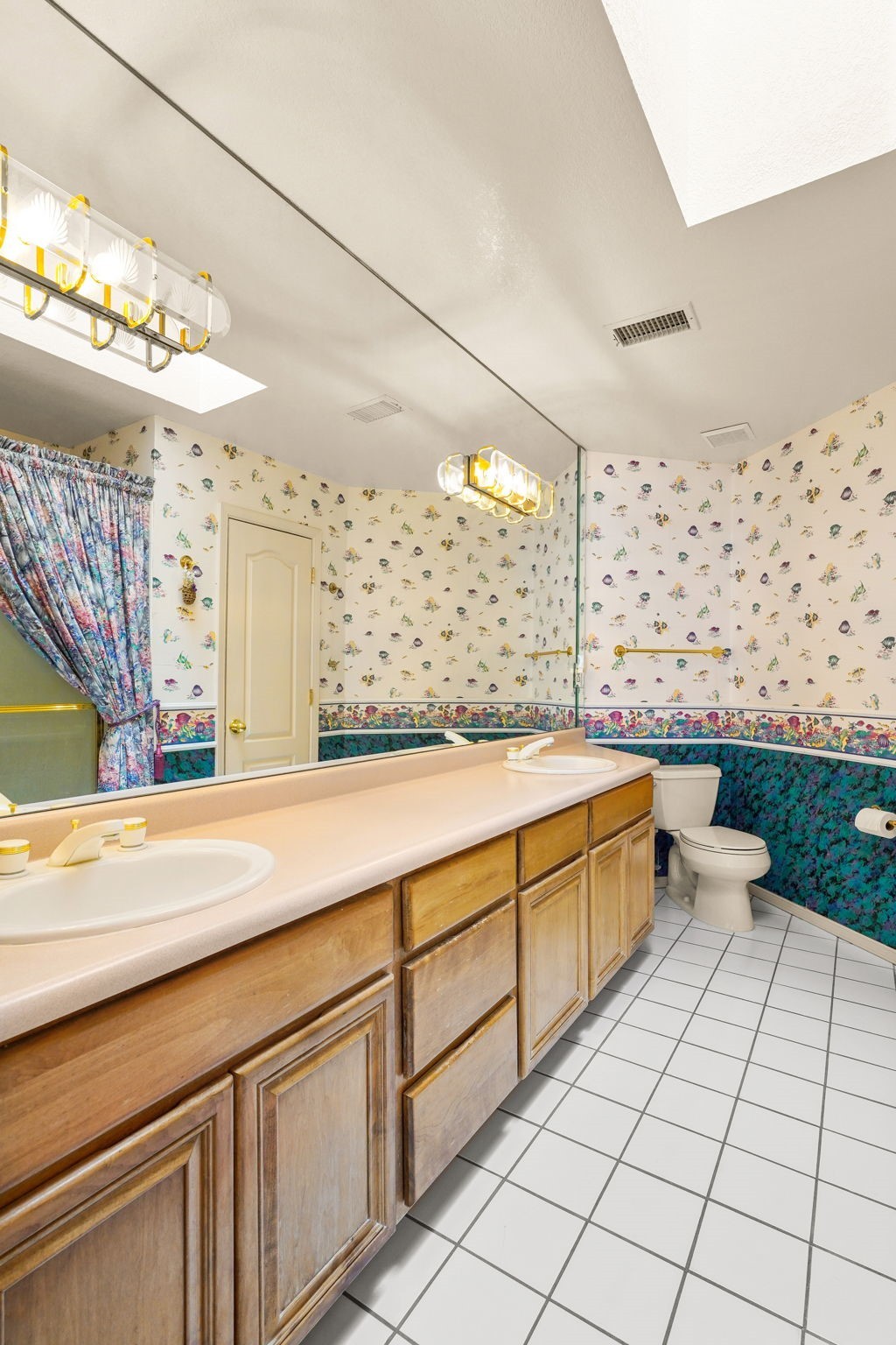 6574 Eagle Ridge Drive El Paso, TX 79912 - Photo 38 of 50 a bathroom with a sink a mirror and a shower