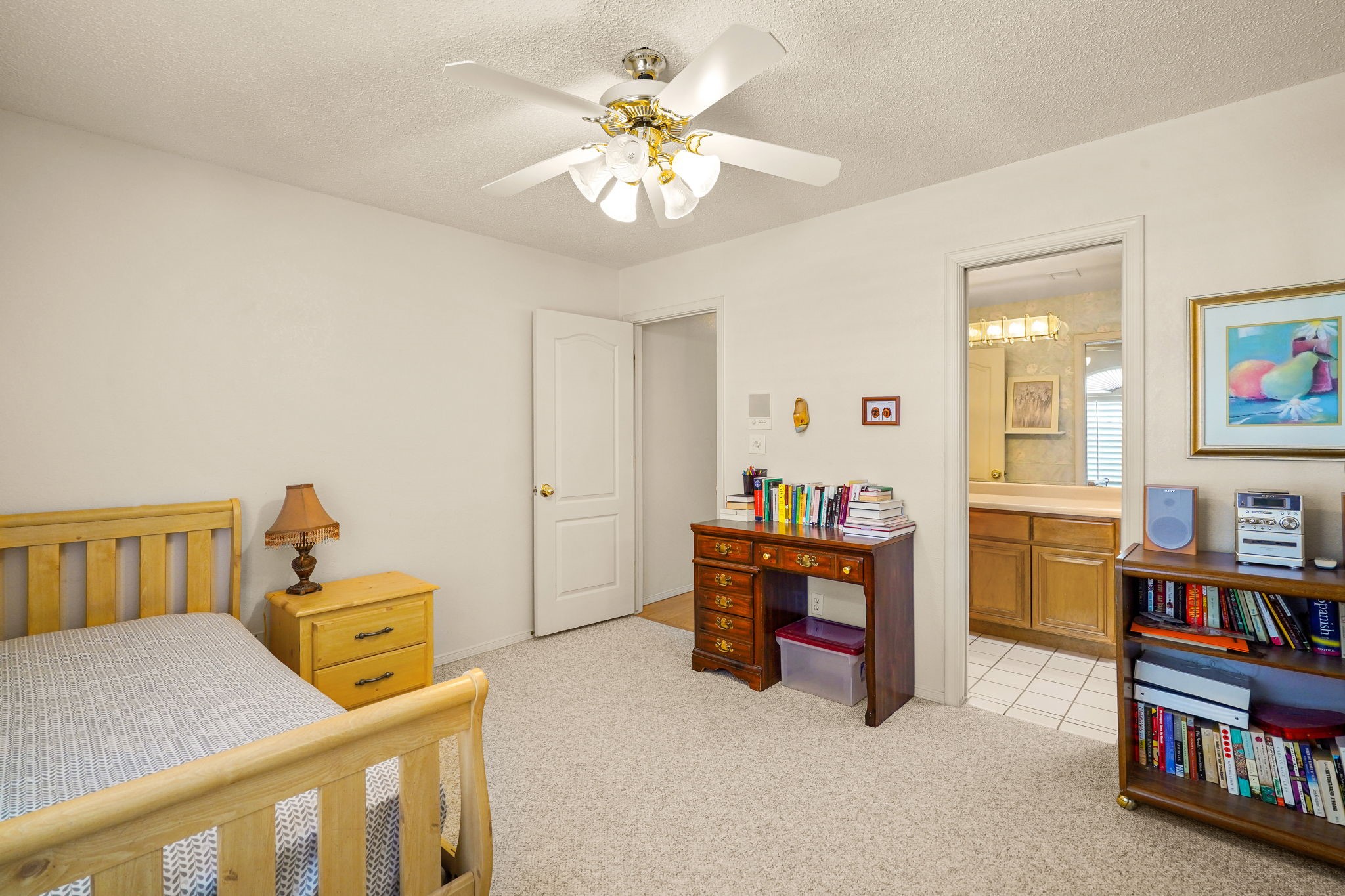 6574 Eagle Ridge Drive El Paso, TX 79912 - Photo 42 of 50 a bedroom with furniture and a book shelf
