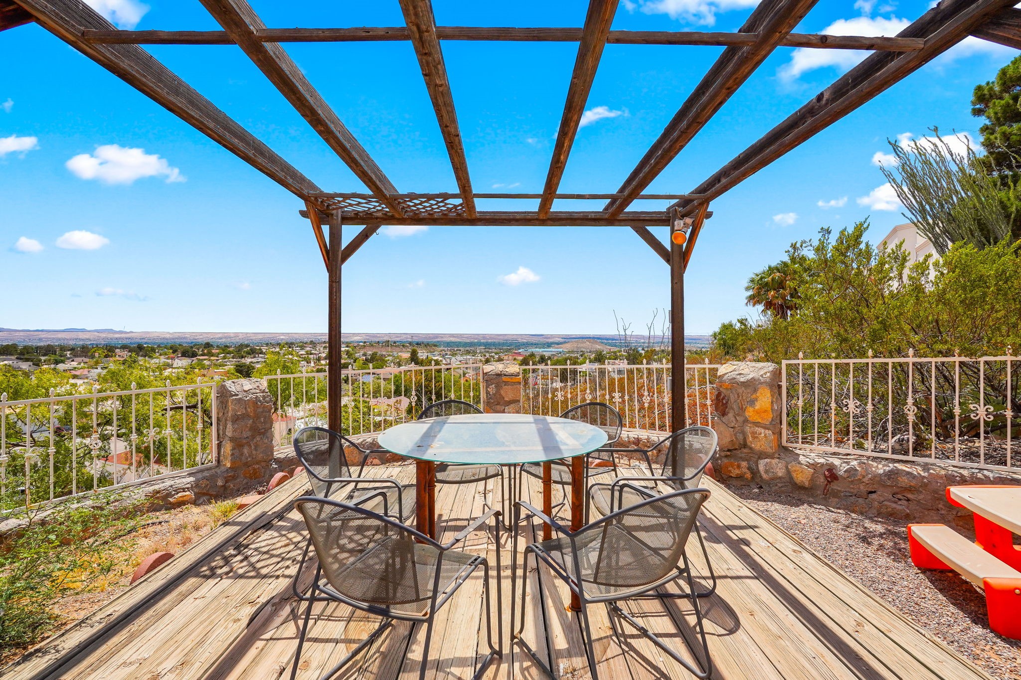 6574 Eagle Ridge Drive El Paso, TX 79912 - Photo 46 of 50 a view of a balcony with furniture and floor to ceiling window