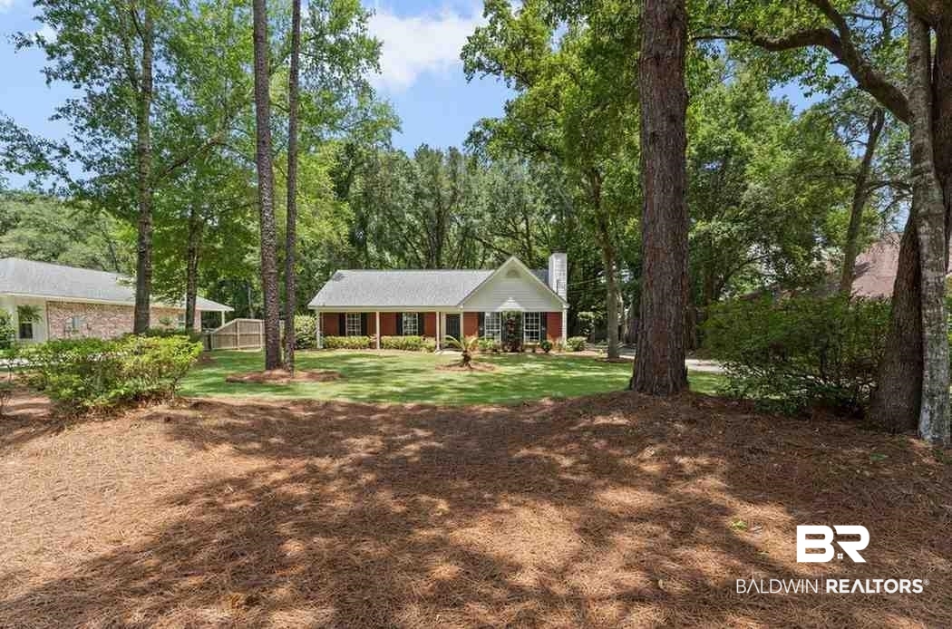 10251 Windmill Road Fairhope, AL 36532 - Photo 2 of 44 View of front of property with a chimney and a front lawn