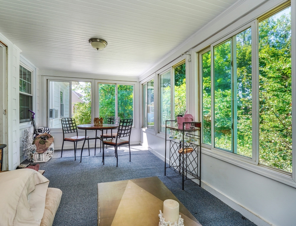 27 Ledyard Road Winchester, MA 01890 - Photo 11 of 38 a living room with furniture and a large window