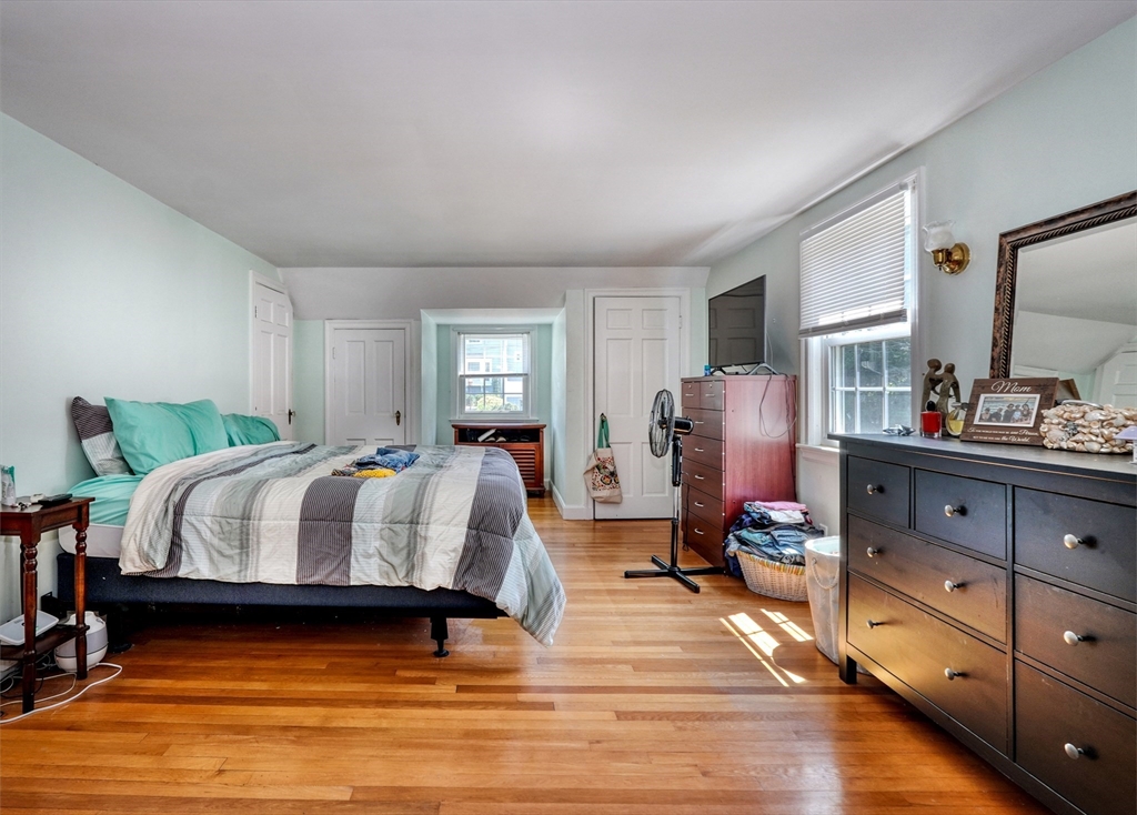27 Ledyard Road Winchester, MA 01890 - Photo 17 of 38 a spacious bedroom with a bed and wooden floor