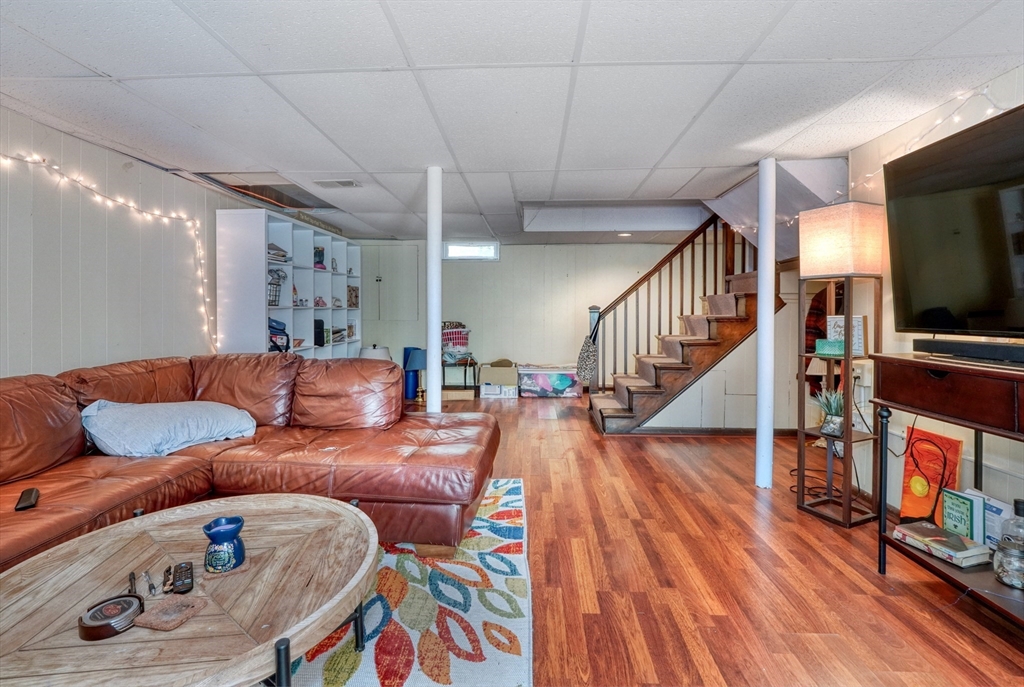 27 Ledyard Road Winchester, MA 01890 - Photo 22 of 38 a living room with furniture and a flat screen tv
