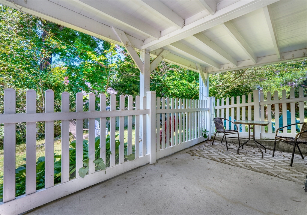 27 Ledyard Road Winchester, MA 01890 - Photo 24 of 38 a view of a chairs and table in the patio