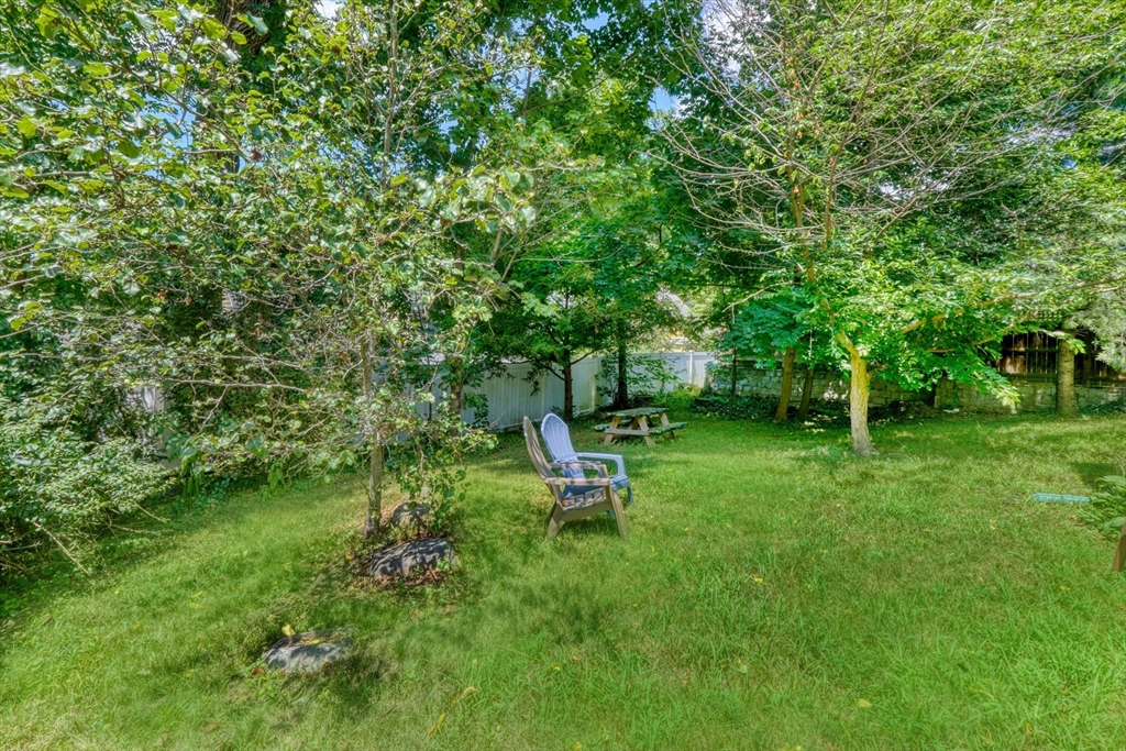 27 Ledyard Road Winchester, MA 01890 - Photo 29 of 38 a view of a backyard with a garden and trees