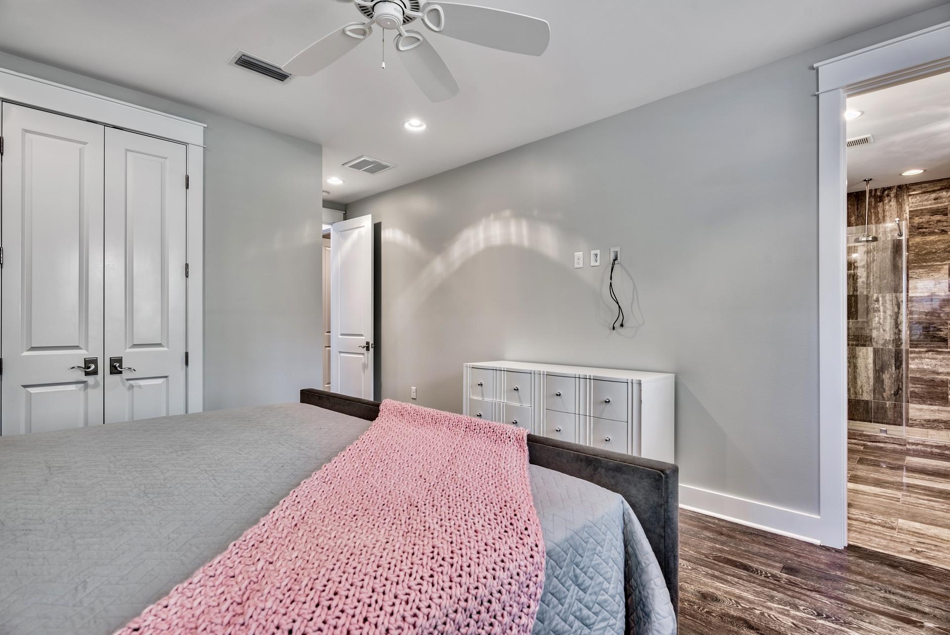 173 Anchor Rode Circle Santa Rosa Beach, FL 32459 - Photo 22 of 35 a bedroom with a bed and a chandelier
