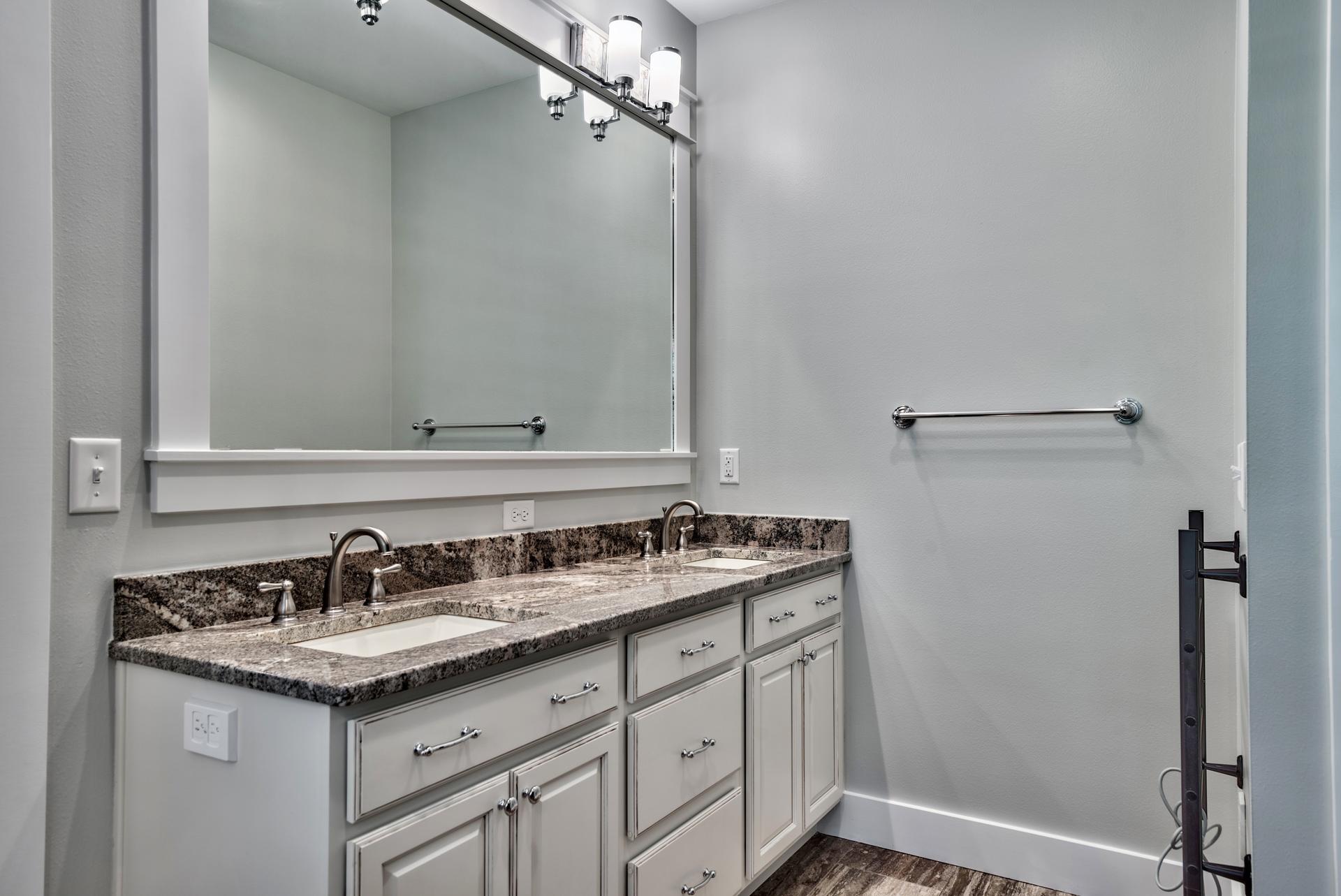 173 Anchor Rode Circle Santa Rosa Beach, FL 32459 - Photo 23 of 35 a bathroom with a granite countertop sink and a mirror