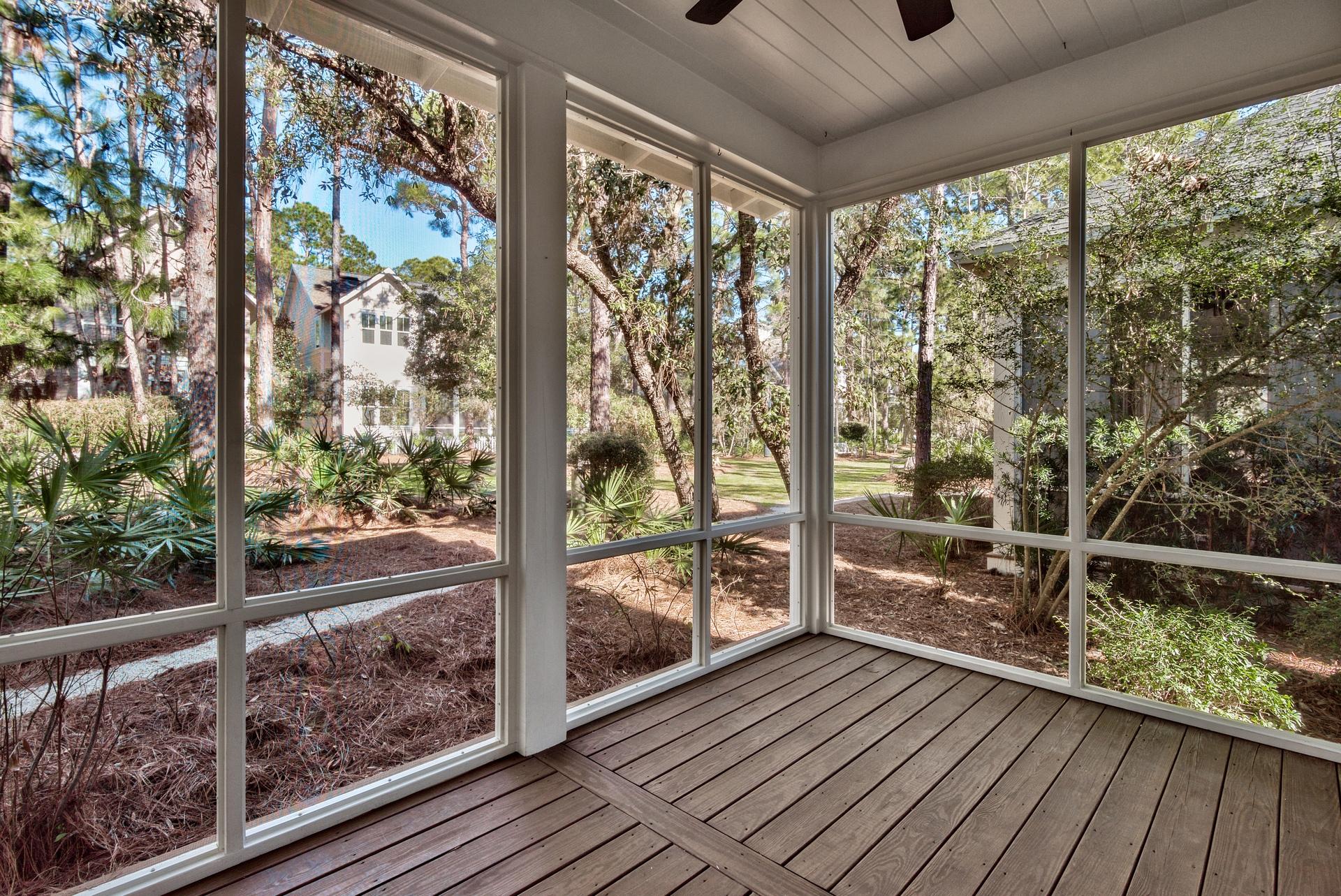 173 Anchor Rode Circle Santa Rosa Beach, FL 32459 - Photo 25 of 35 a view of a balcony with floor to ceiling windows with wooden floor
