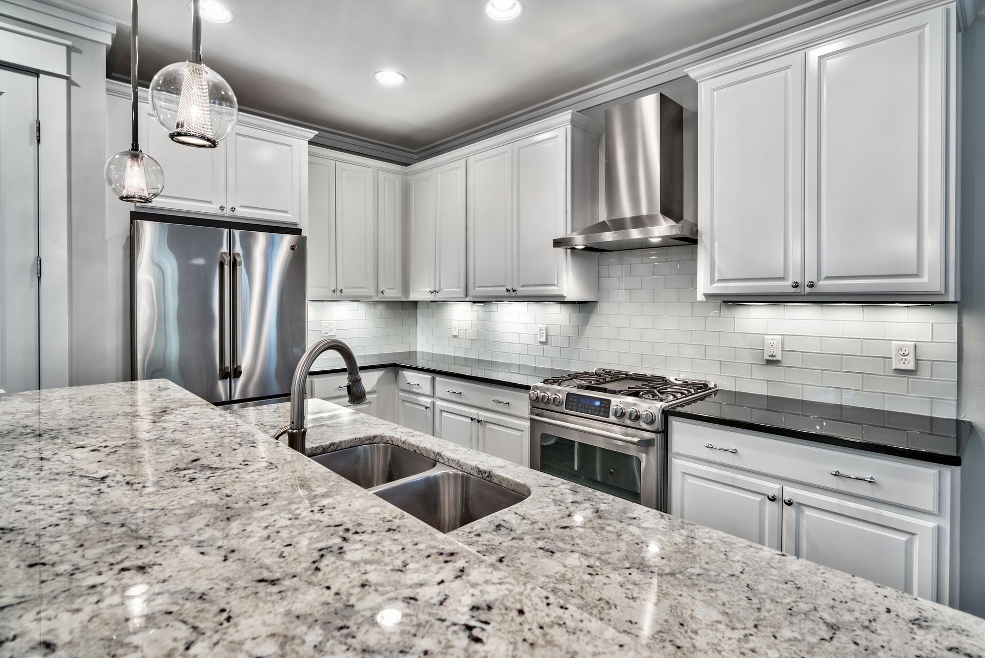 173 Anchor Rode Circle Santa Rosa Beach, FL 32459 - Photo 4 of 35 a kitchen with stainless steel appliances granite countertop a sink stove and refrigerator