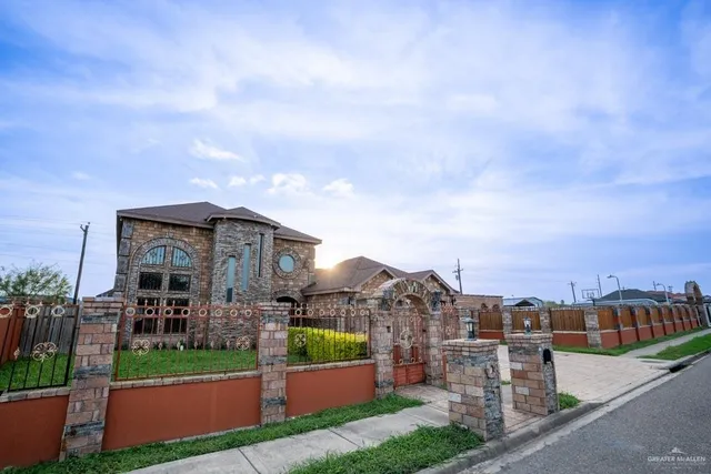 a city view with tall buildings and a yard