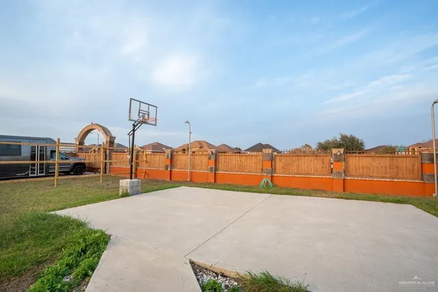 a view of a garden with a house