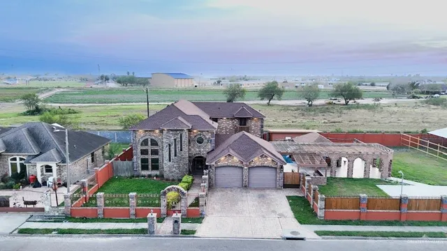 a view of swimming pool with a yard and plants