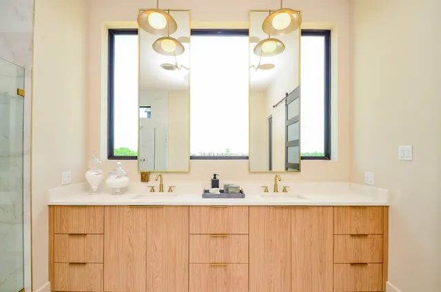 a bed room with a bed a couch and a large window