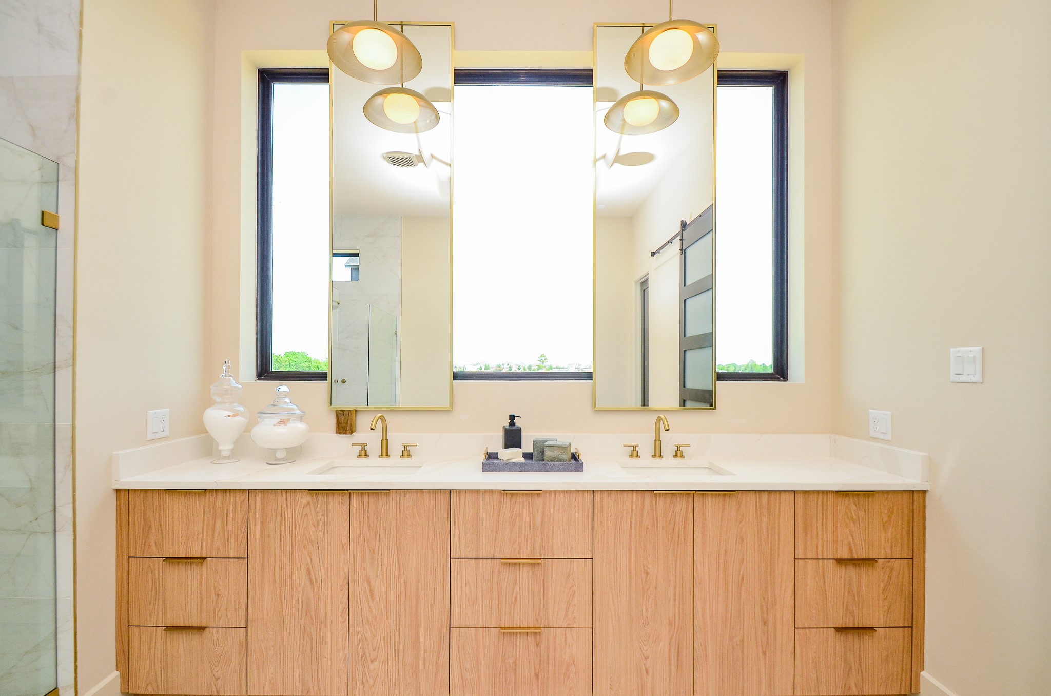 20218 Tealpointe Ridge Lane Tomball, TX 77377 - Photo 19 of 50 a bathroom with a double vanity sink and a mirror