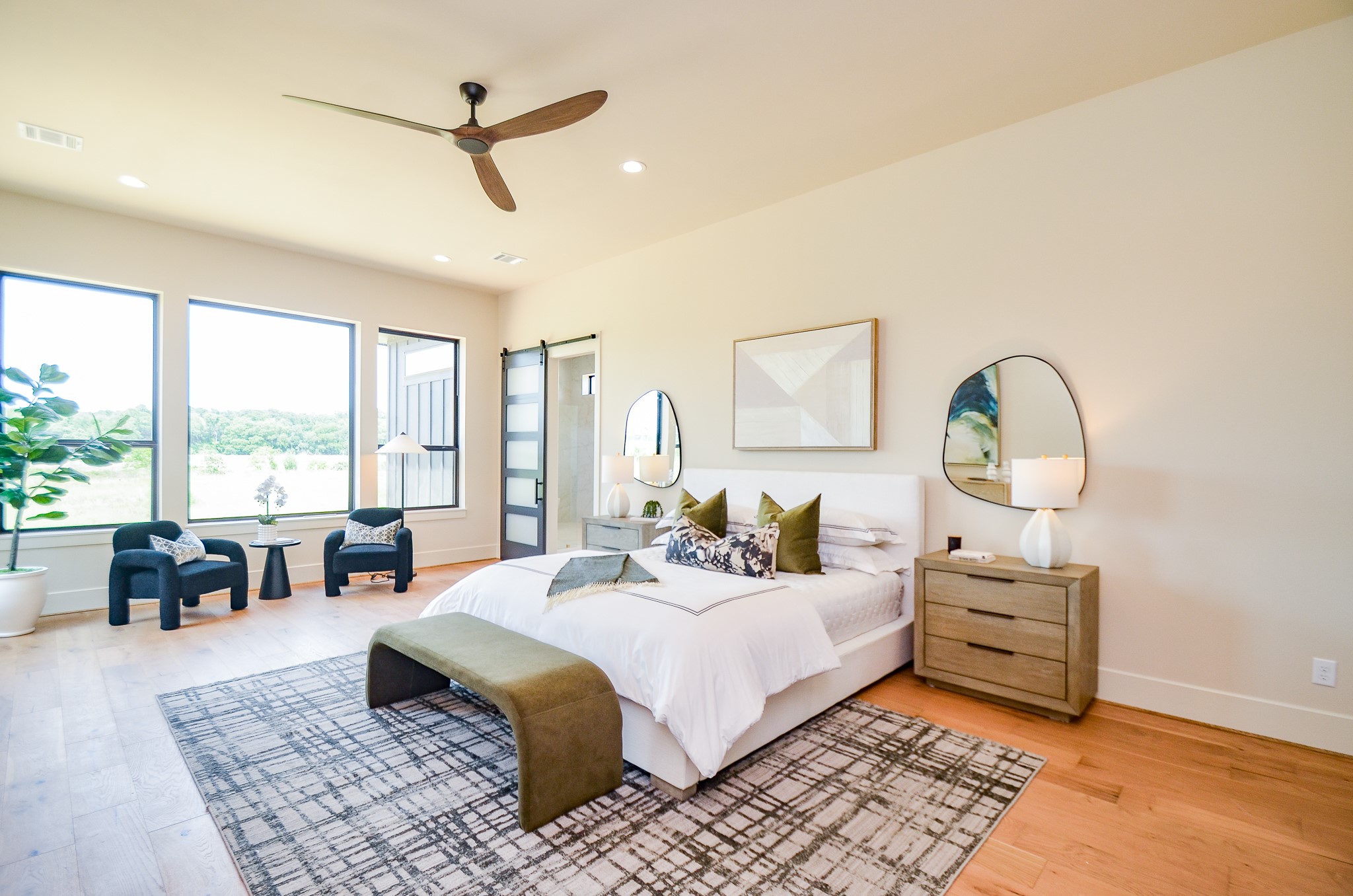 20218 Tealpointe Ridge Lane Tomball, TX 77377 - Photo 20 of 50 a bed room with a bed a couch and a large window