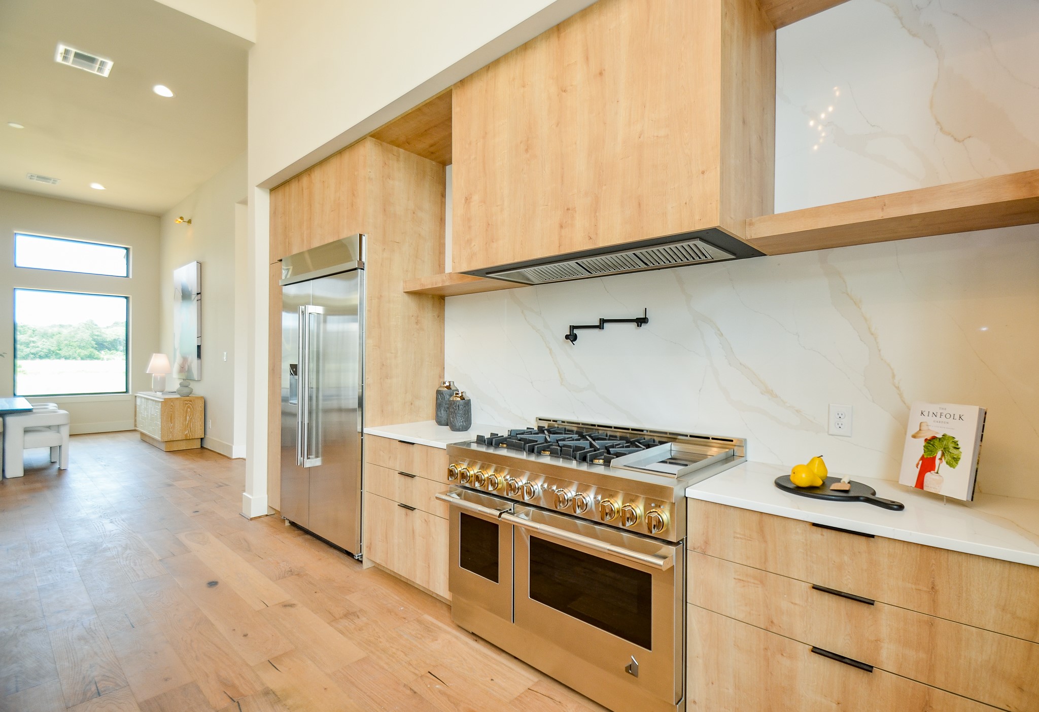 20218 Tealpointe Ridge Lane Tomball, TX 77377 - Photo 33 of 50 a kitchen with stainless steel appliances granite countertop a stove and a sink