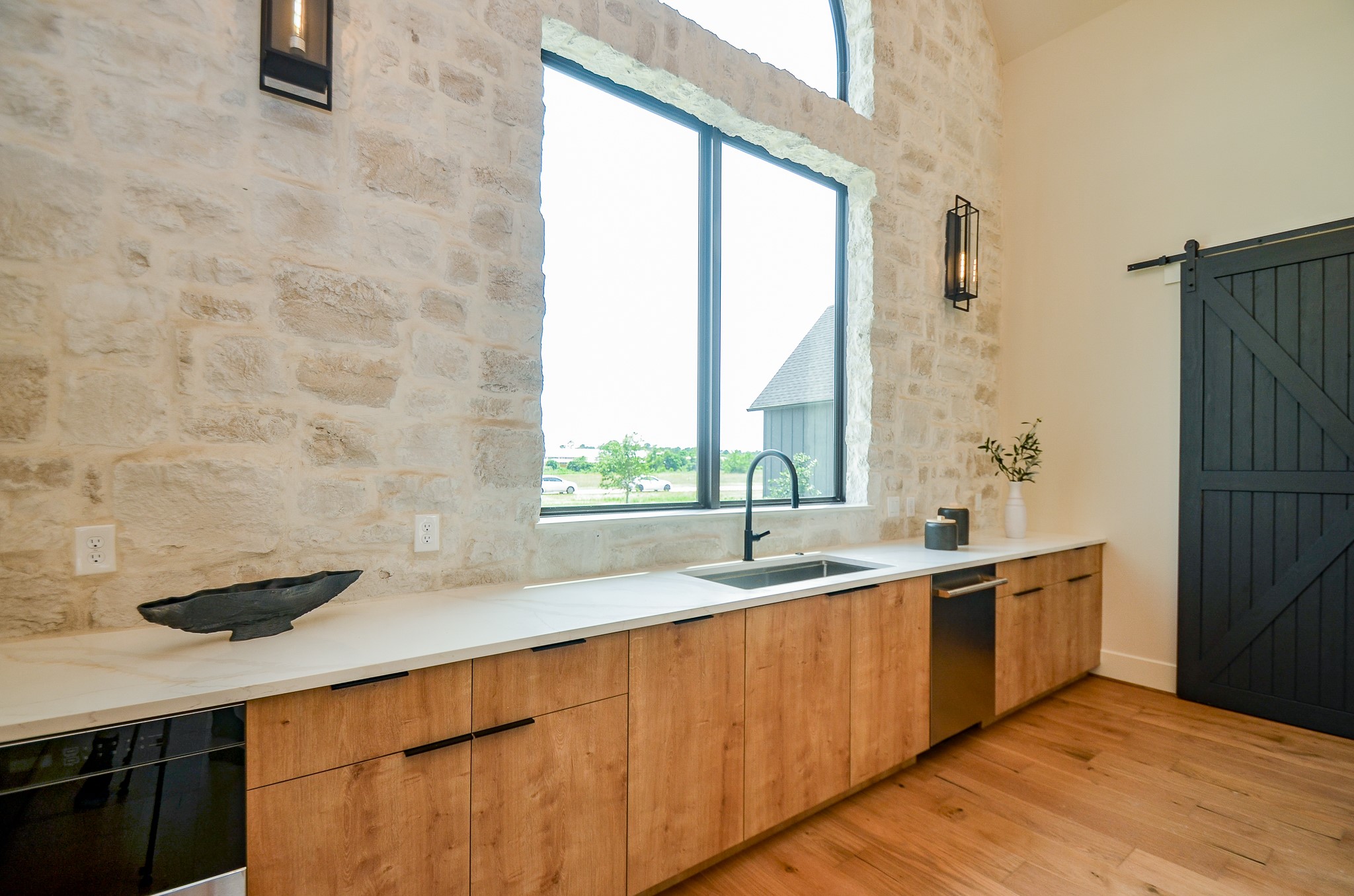 20218 Tealpointe Ridge Lane Tomball, TX 77377 - Photo 35 of 50 a kitchen with stainless steel appliances a sink and a window