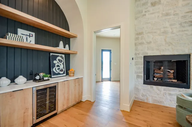 a kitchen with a sink a stove and cabinets