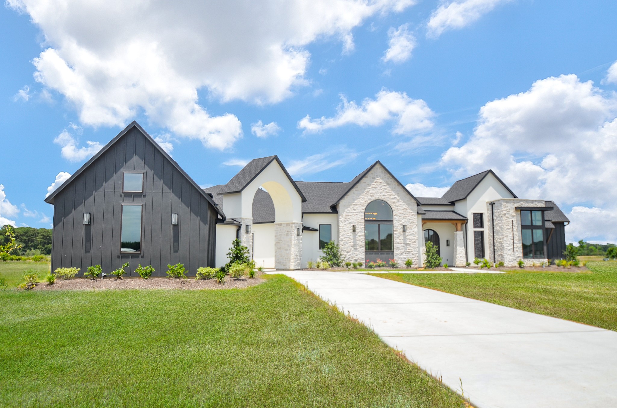 20218 Tealpointe Ridge Lane Tomball, TX 77377 - Photo 4 of 50 a front view of a house with a yard and garage