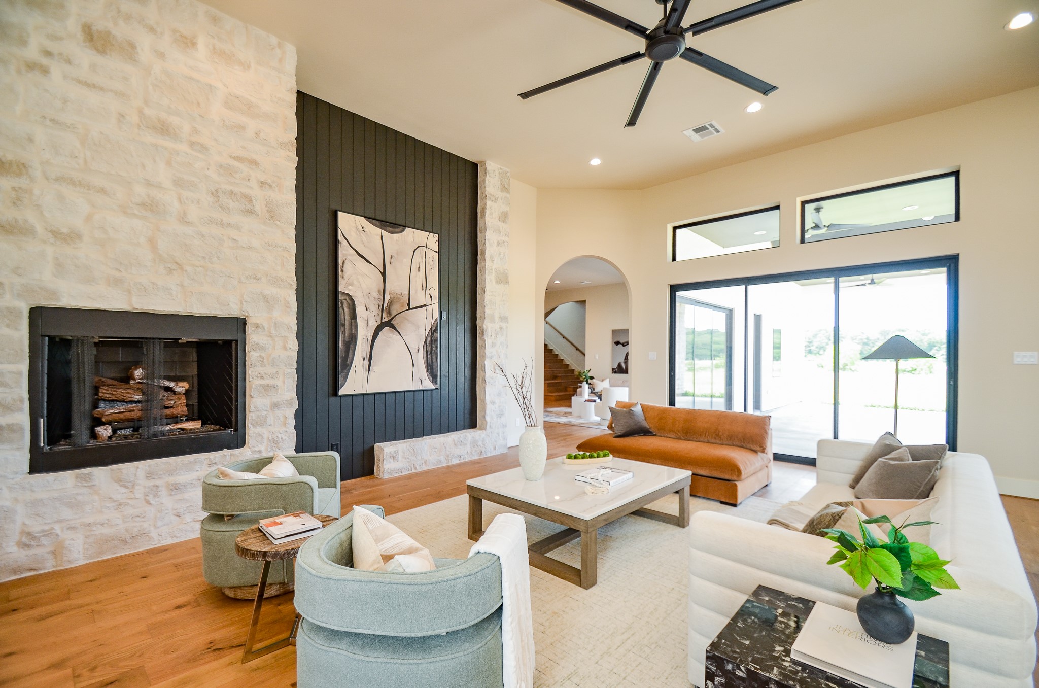 20218 Tealpointe Ridge Lane Tomball, TX 77377 - Photo 43 of 50 a living room with furniture a fireplace and a flat screen tv