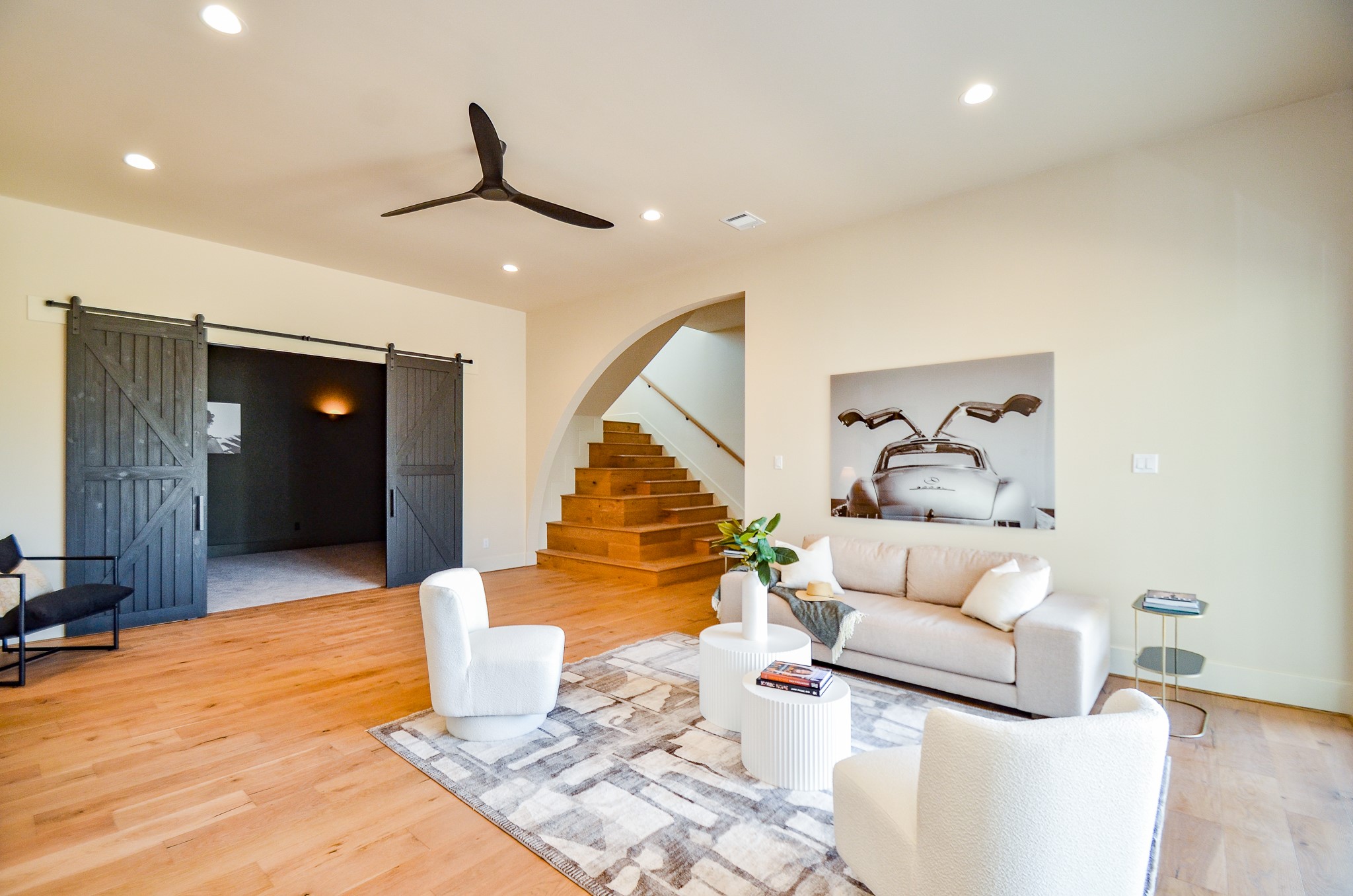 20218 Tealpointe Ridge Lane Tomball, TX 77377 - Photo 46 of 50 a living room with furniture and a wooden floor