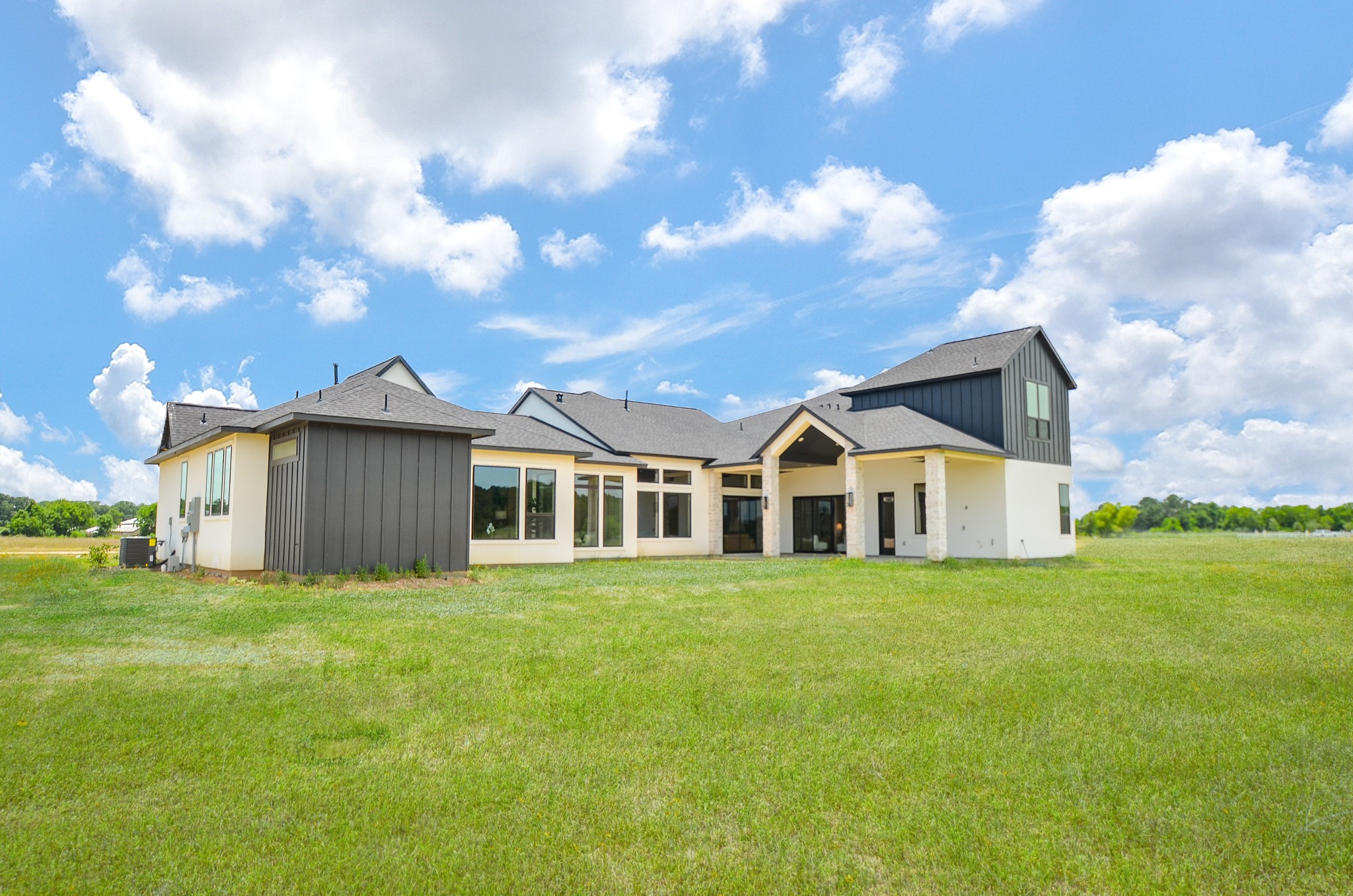 20218 Tealpointe Ridge Lane Tomball, TX 77377 - Photo 7 of 50 a front view of a house with a garden