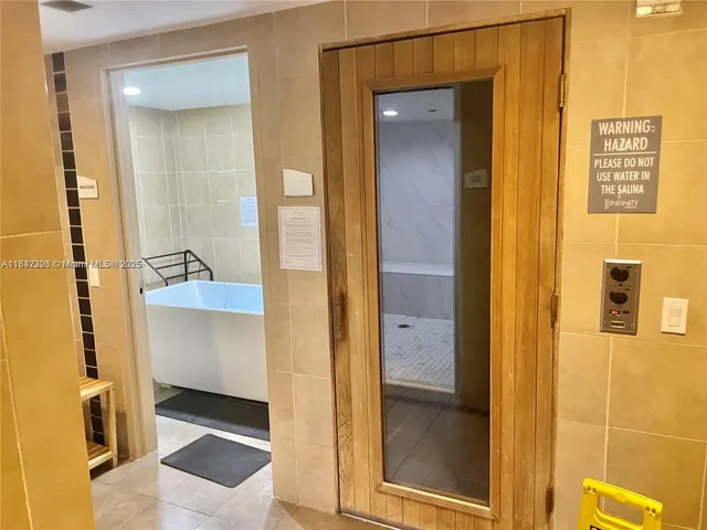 a bathroom with a tub and a shower