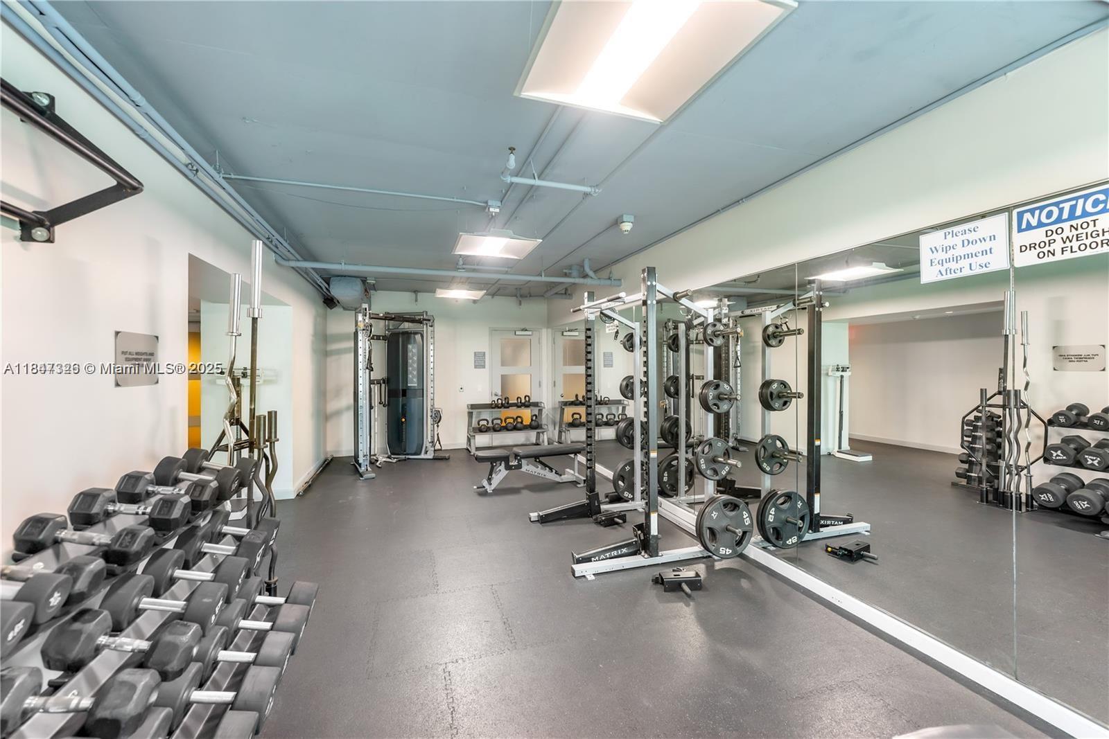 60 Southwest 13th Street, Unit 1605 Miami, FL 33130 - Photo 16 of 28 a view of a room with gym equipment