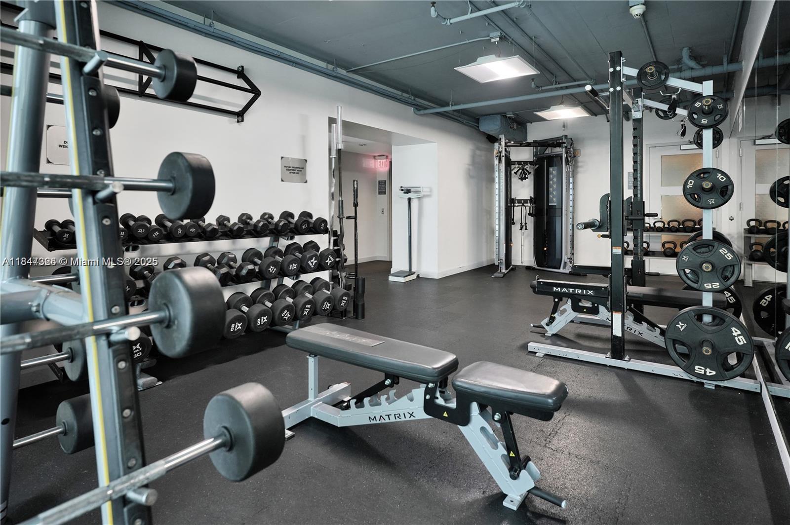 60 Southwest 13th Street, Unit 1605 Miami, FL 33130 - Photo 17 of 28 a room with gym equipment