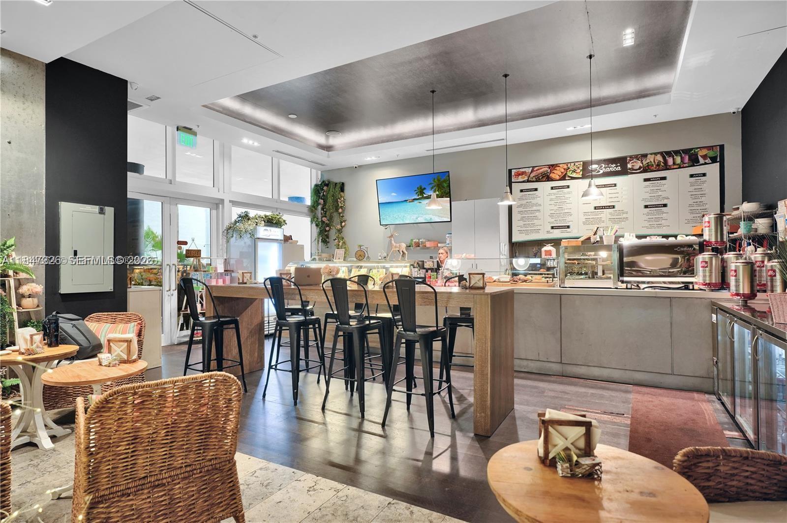 60 Southwest 13th Street, Unit 1605 Miami, FL 33130 - Photo 19 of 25 a living room with lots of furniture and a large window