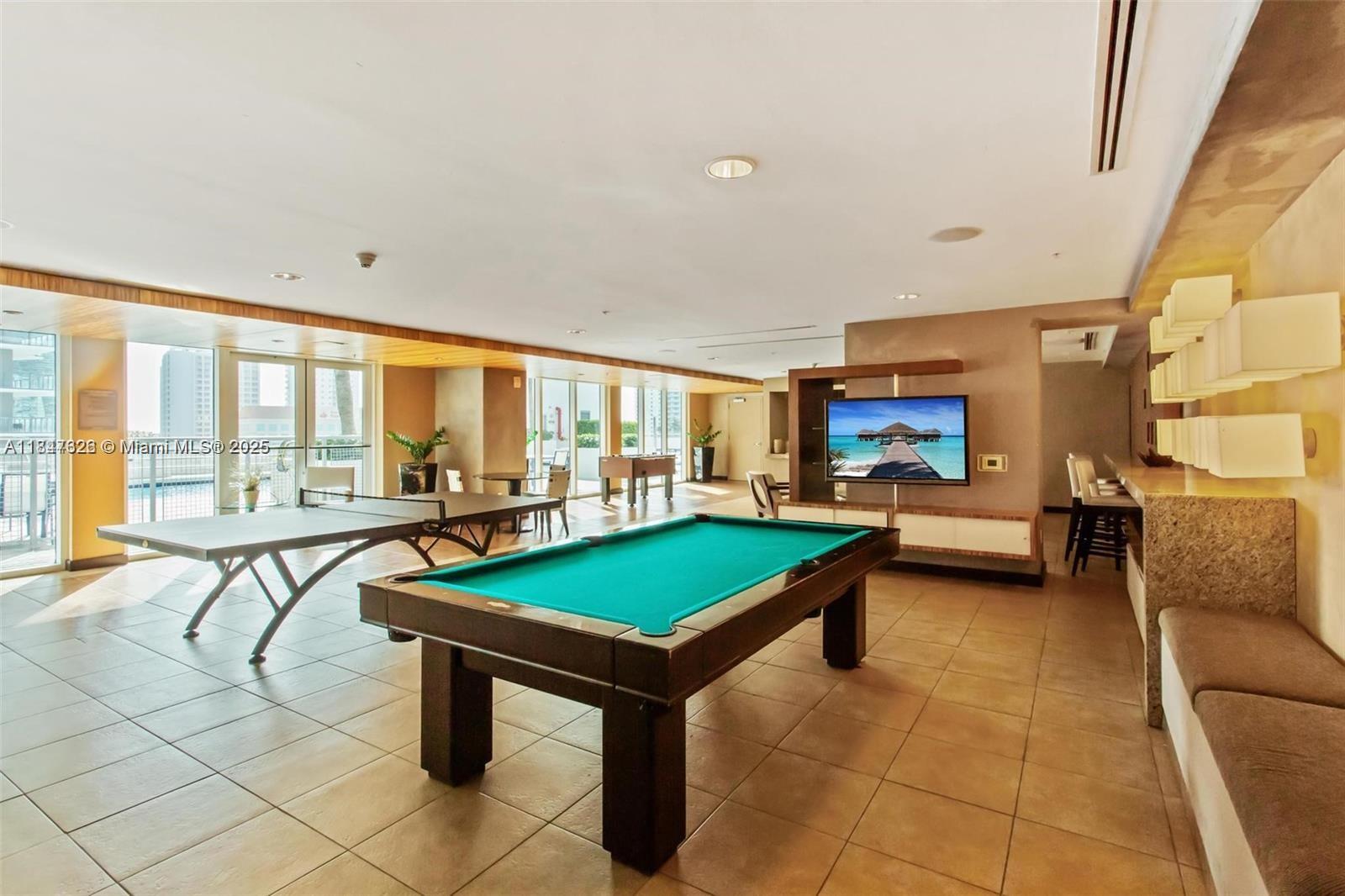 60 Southwest 13th Street, Unit 1605 Miami, FL 33130 - Photo 20 of 28 a room with furniture and pool table