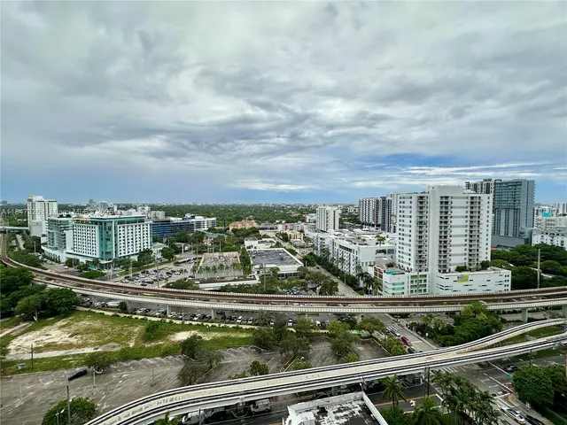 aerial view of a residential houses with city view
