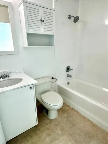 a bathroom with a sink toilet and bathtub