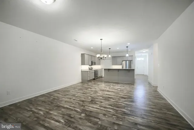 a view of a kitchen and kitchen with a sink
