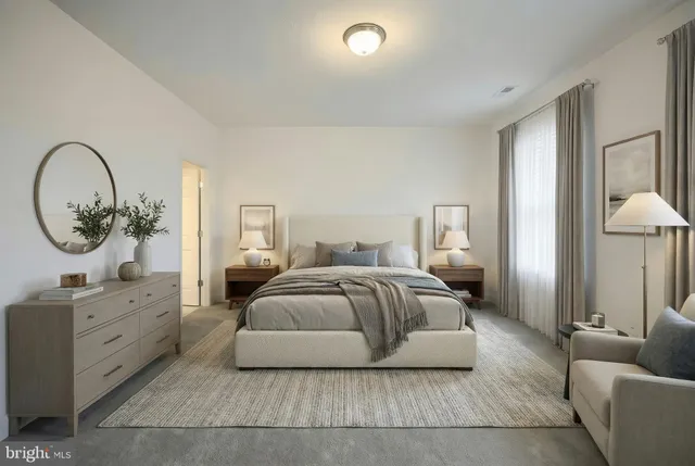 a bedroom with a bed and a couch