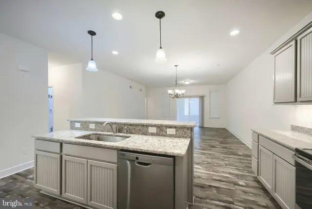 a bathroom with a sink a vanity and a large mirror