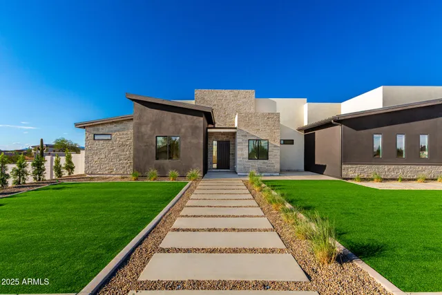 a kitchen with kitchen island counter top space cabinets and stainless steel appliances