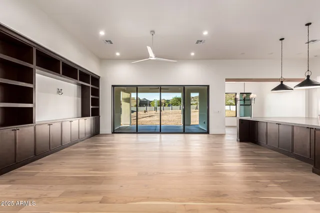 a bathroom with a granite countertop sink a toilet and mirror
