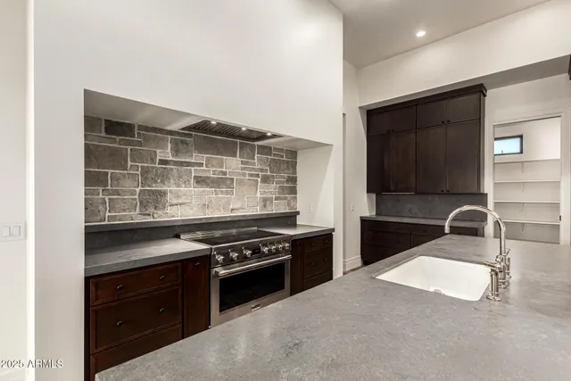 a bathroom with a sink shower and a toilet