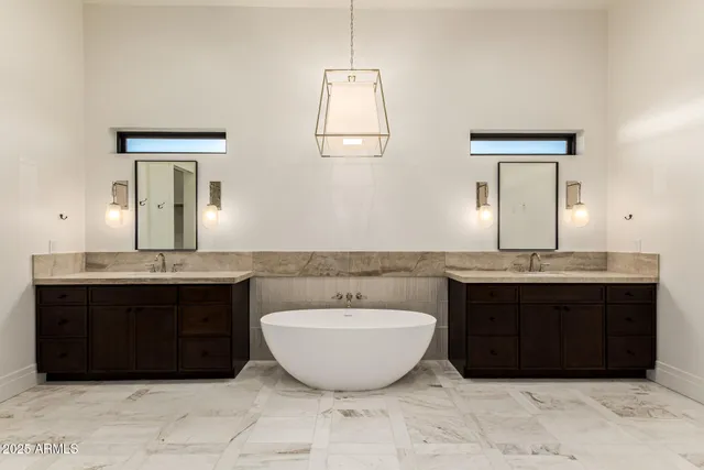 a spacious bathroom with a sink and a mirror