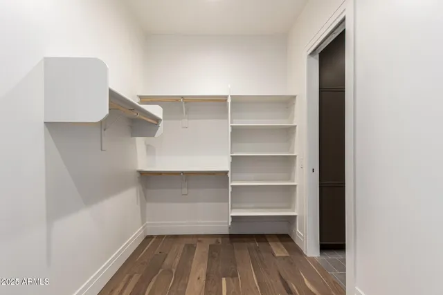 a view of a house with a yard and a garage