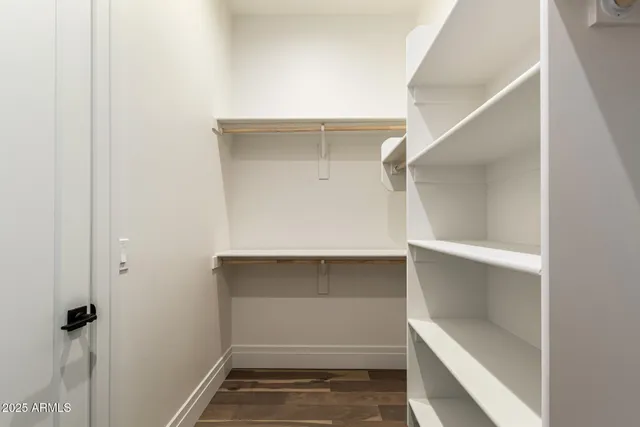 an aerial view of residential houses with a yard and mountain view