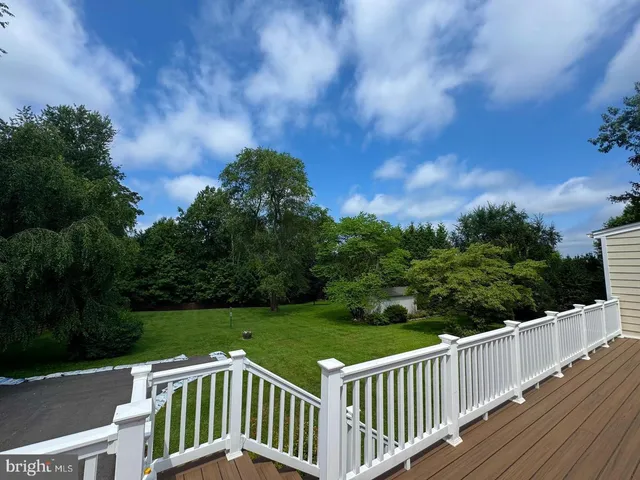 a view of a wooden deck and yard