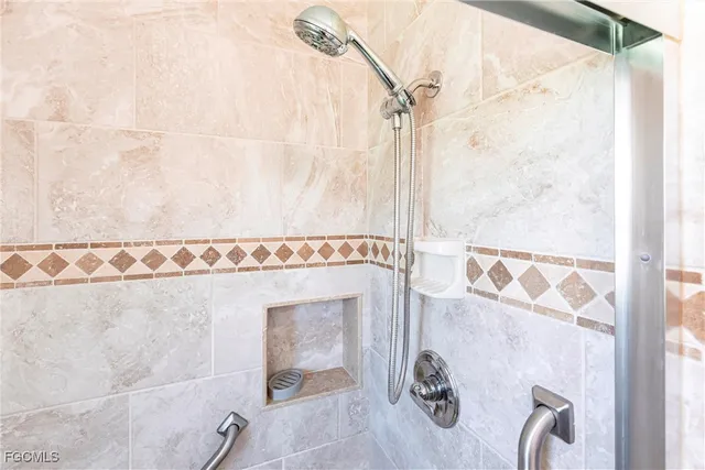 a bathroom with a shower and a sink