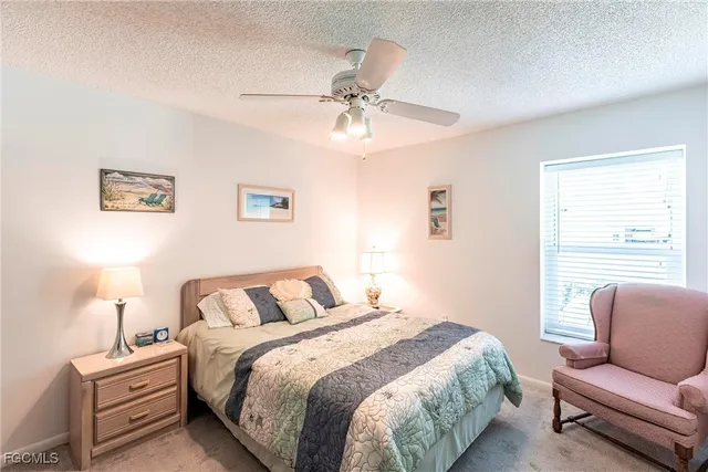 a bedroom with bed and window