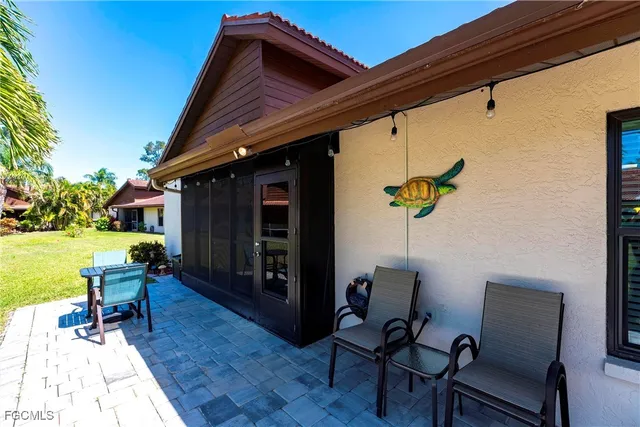 a patio with table and chairs