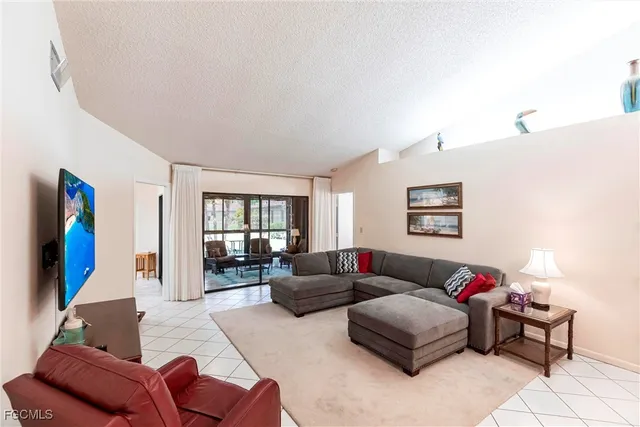 a living room with furniture or couch and a flat screen tv